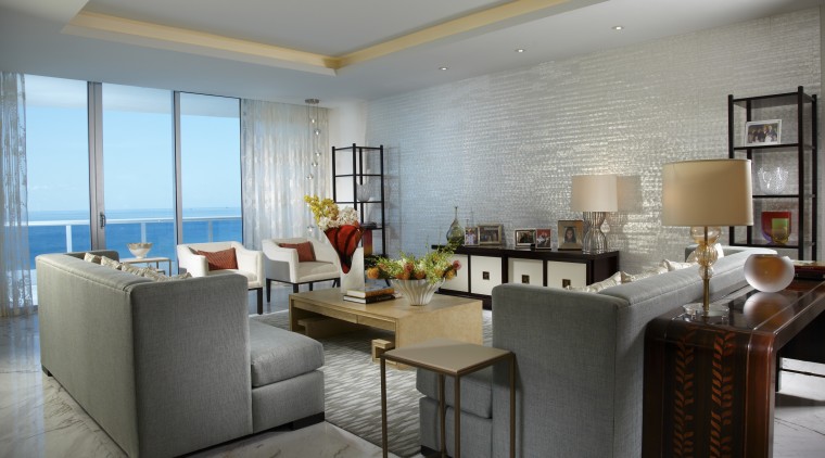 A mother-of-pearl wall by Maya Romanoff is a dining room, interior design, living room, real estate, room, table, gray