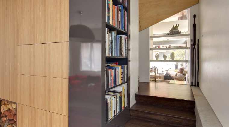The view from the front door of this bookcase, furniture, interior design, shelf, shelving, gray