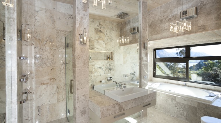 Natural stone and mirrors abound in this family architecture, bathroom, estate, home, interior design, property, real estate, room, gray