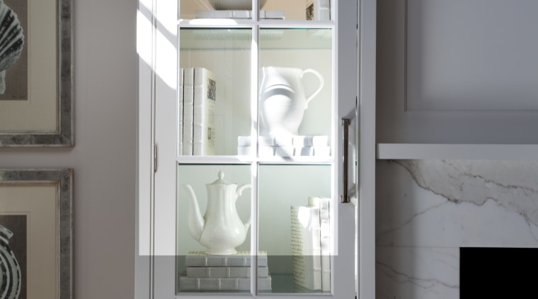 A close up view of kitchen cabinetry from cabinetry, display case, door, furniture, home, interior design, room, sash window, shelf, shelving, wall, window, gray