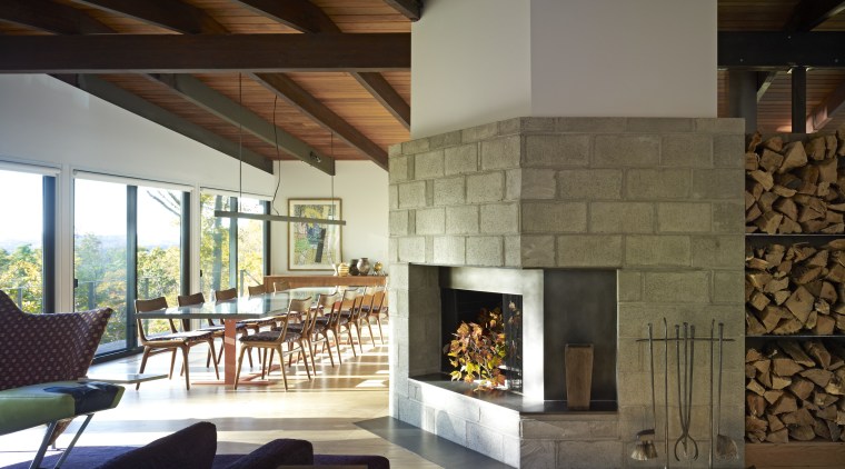 The original ceramic tile fireplace surround in this fireplace, hearth, interior design, living room, wood burning stove, brown