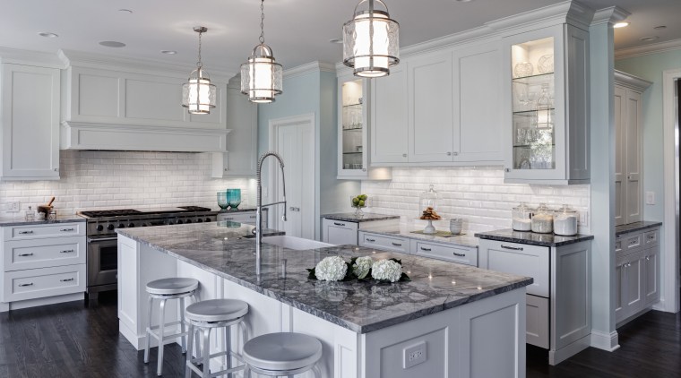 Symmetry is a key feature of this remodeled cabinetry, countertop, cuisine classique, floor, flooring, home, interior design, kitchen, room, gray
