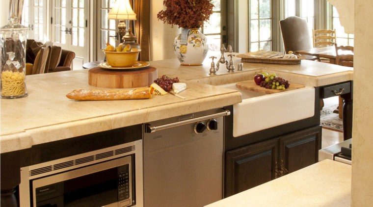 Dark wood beams in this Provencal-style kitchen relieve cabinetry, countertop, cuisine classique, floor, flooring, furniture, interior design, kitchen, room, orange, brown