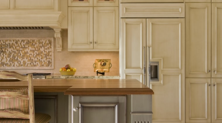 The semi-integrated refrigerator in this kitchen by Rill cabinetry, countertop, cuisine classique, floor, flooring, furniture, hardwood, home, interior design, kitchen, room, wood flooring, orange, gray, brown