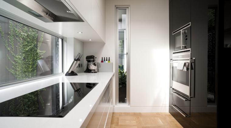 High-gloss black lacquer features on the front of interior design, kitchen, real estate, white, black