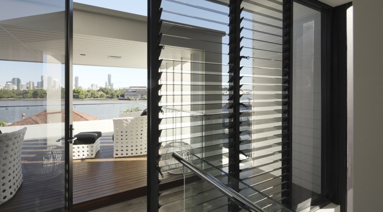 An internal staircase leads to the roof deck architecture, condominium, daylighting, door, glass, house, interior design, real estate, window, window blind, window covering, window treatment, gray, black