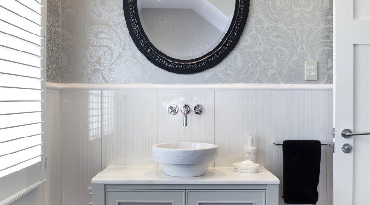 The vanity in the guest bathroom is painted bathroom, bathroom accessory, bathroom cabinet, bathroom sink, floor, flooring, home, interior design, plumbing fixture, product design, room, sink, tap, gray