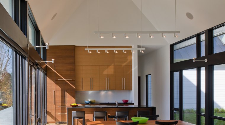 Clapboard siding and a metal roof place this architecture, ceiling, daylighting, estate, home, house, interior design, living room, real estate, gray, brown