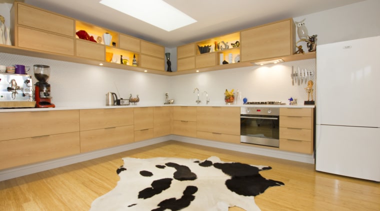 Cantilevered cabinetry is a feature of this kitchen floor, flooring, interior design, kitchen, room, gray, orange