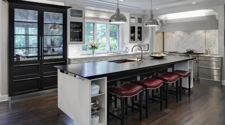 This Mick De Giulio  kitchen responds to cabinetry, countertop, cuisine classique, floor, flooring, interior design, kitchen, room, table, gray, black