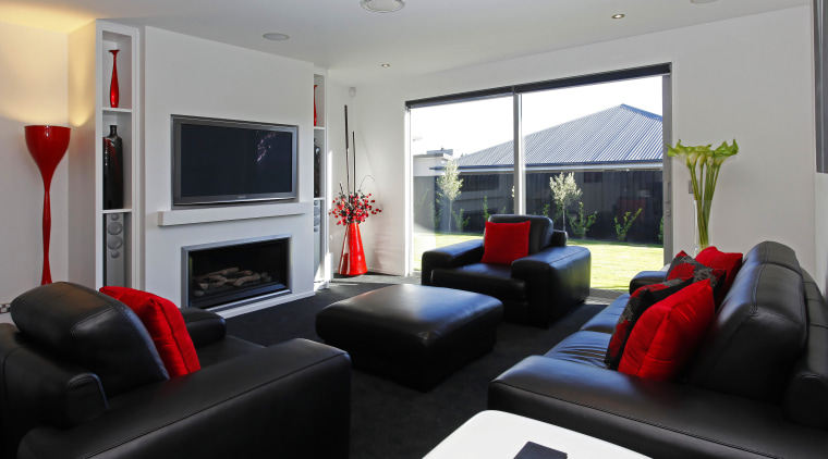 The crisp black and white interior is enlivened interior design, living room, real estate, room, gray, black