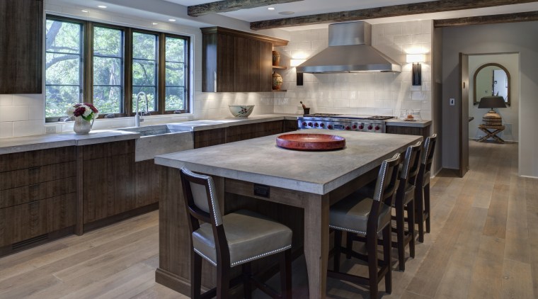In this kitchen remodel by Doug Durbin, the cabinetry, countertop, cuisine classique, floor, flooring, hardwood, interior design, kitchen, laminate flooring, room, wood flooring, gray, black