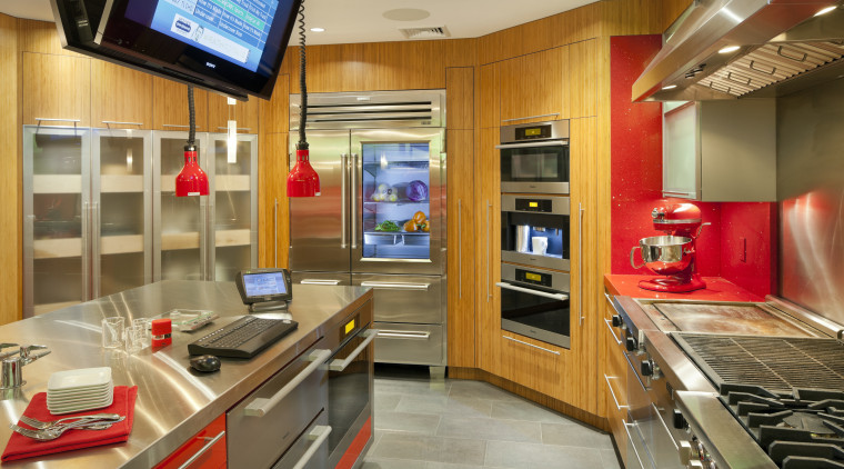 Cabinets in this test kitchen feature a mix countertop, interior design, kitchen, real estate, orange, brown