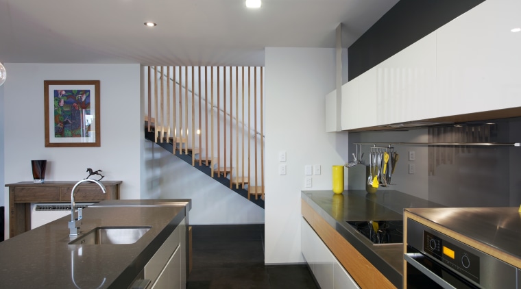 This kitchen designed by Melanie Craig Design features architecture, countertop, interior design, kitchen, real estate, gray, black