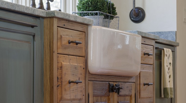 This sink cabinet juts out into the room, bathroom, bathroom accessory, bathroom cabinet, cabinetry, chest of drawers, countertop, cuisine classique, drawer, floor, furniture, hardwood, kitchen, room, sideboard, sink, wood, wood stain, gray, brown