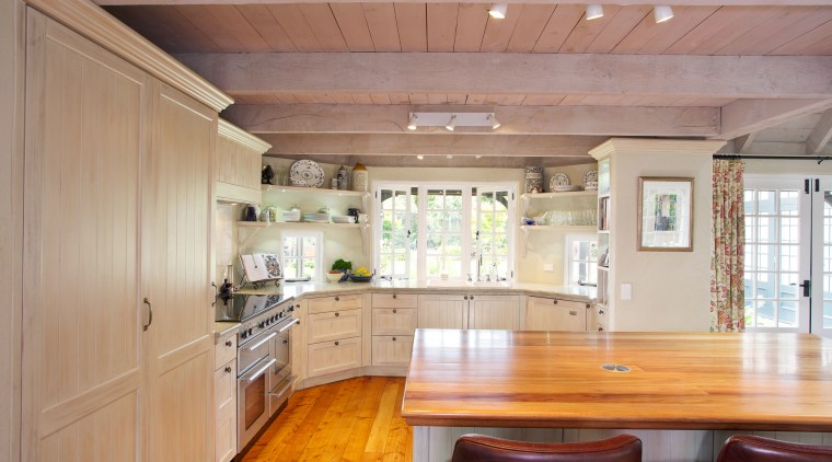 Open shelving provides extra storage and gives a cabinetry, ceiling, countertop, cuisine classique, estate, floor, hardwood, home, house, interior design, kitchen, property, real estate, room, wood, wood flooring, gray, orange