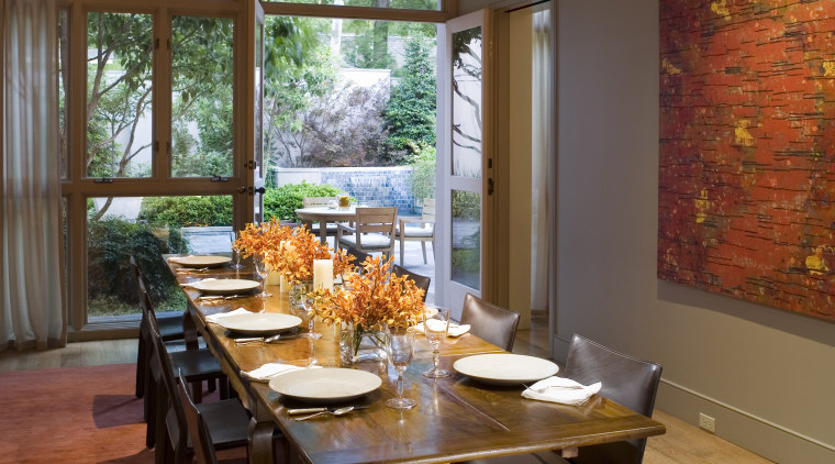 This formal dining room adjoins the kitchen. Like dining room, home, interior design, living room, room, table, window, brown