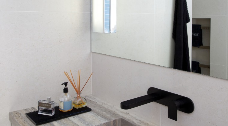 This bathroom was transformed by designer Celia Visser, bathroom, countertop, floor, interior design, product design, room, sink, tap, tile, gray, white