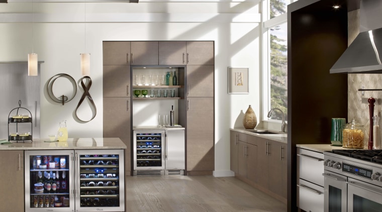 this kitchen is organised into a number of countertop, home appliance, interior design, kitchen, kitchen appliance, major appliance, refrigerator, gray