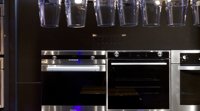 While the show space is modest the appliance glass, interior design, kitchen, light, light fixture, lighting, purple, black