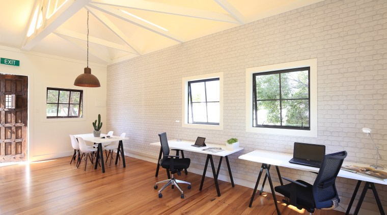 Light-filled and airy, the studios are finished in ceiling, daylighting, dining room, floor, flooring, furniture, house, interior design, real estate, room, table, window, wood flooring, orange