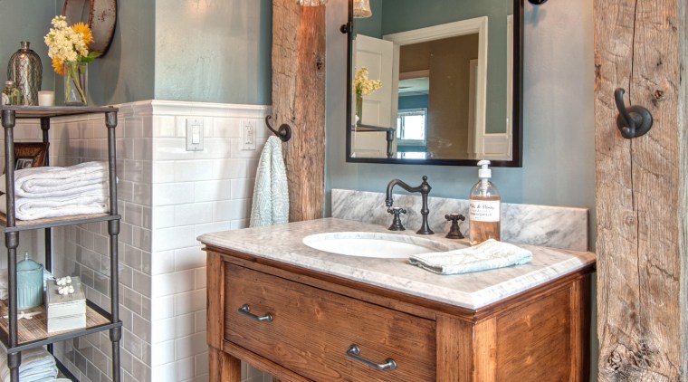 This modest guest bathroom celebrates a relaxed seaside bathroom, bathroom cabinet, cabinetry, countertop, interior design, room, gray
