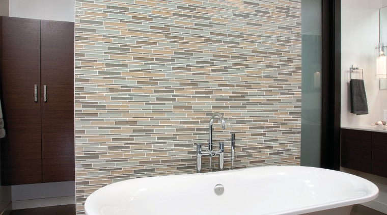 A Victoria &amp; Albert bathtub is the centerpiece architecture, bathroom, floor, flooring, home, interior design, plumbing fixture, room, sink, tap, tile, wall, gray