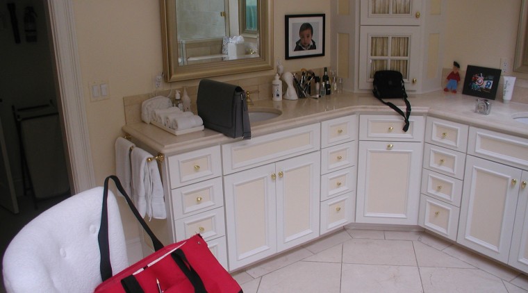 Before remodeling, this bathroom featured fully fitted cabinets cabinetry, countertop, floor, flooring, furniture, home, house, kitchen, property, room, gray