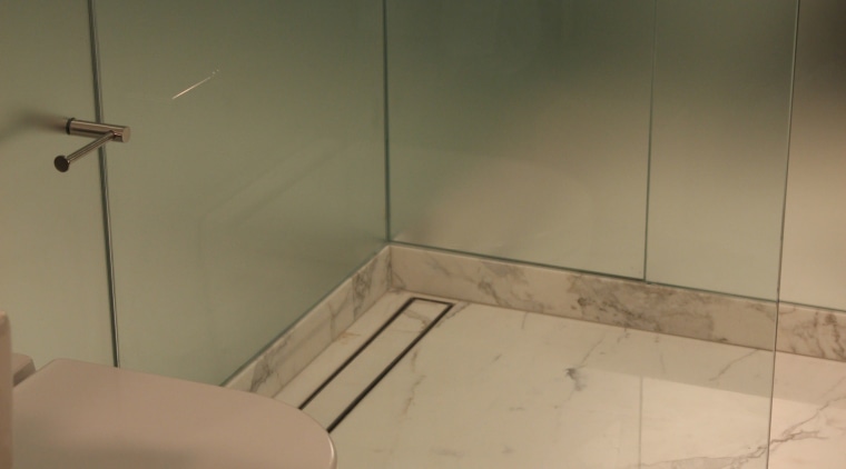 Lux Linear Drains produces decorative, pattern grate design bathroom, floor, flooring, plumbing fixture, property, room, tile, toilet, toilet seat, brown