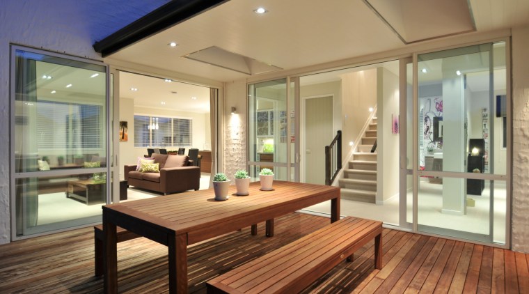 Outdoor living areas are a key part of hardwood, house, interior design, property, real estate, window, wood, brown, orange