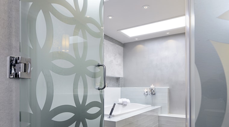A patterned glass privacy wall screens the shower architecture, bathroom, ceiling, daylighting, floor, interior design, room, wall, gray