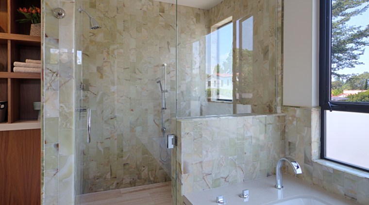 The shower is lined with onyx tiles. To architecture, bathroom, daylighting, estate, floor, flooring, home, interior design, real estate, room, tile, wall, window, gray