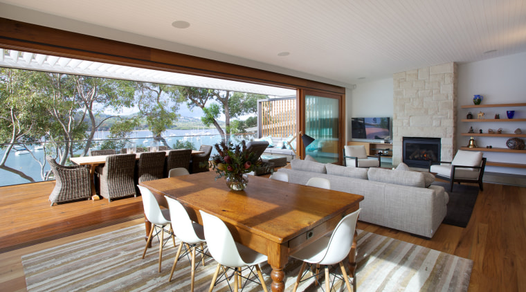 The large sliders is this remodelled house are house, interior design, living room, property, real estate, gray