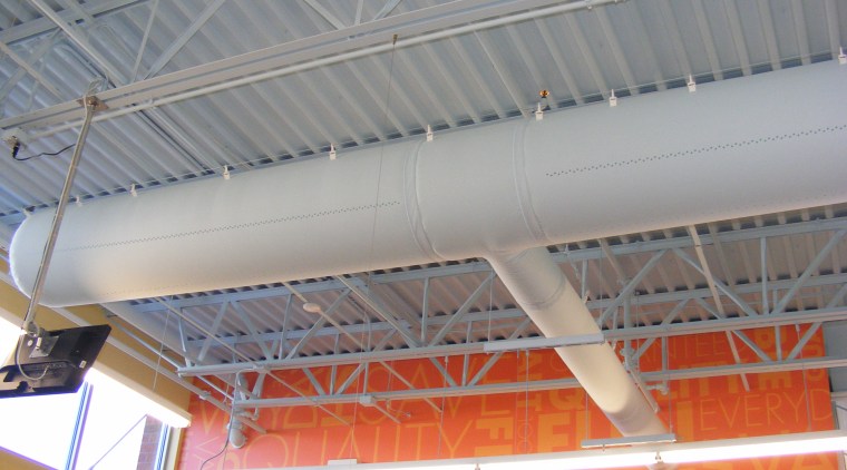 Close-up of the DuctSox Fabric Air Dispersion System, beam, ceiling, daylighting, roof, steel, structure, gray