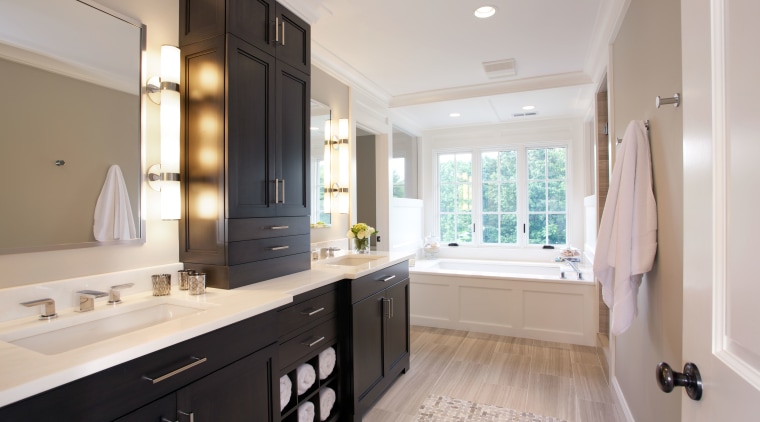 A long dark mahogany vanity provides plenty of bathroom, cabinetry, countertop, estate, home, interior design, kitchen, property, real estate, room, sink, gray