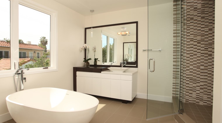 In this bathroom project by designer Christopher Grubb, bathroom, estate, floor, flooring, home, interior design, property, real estate, room, tile, window, orange