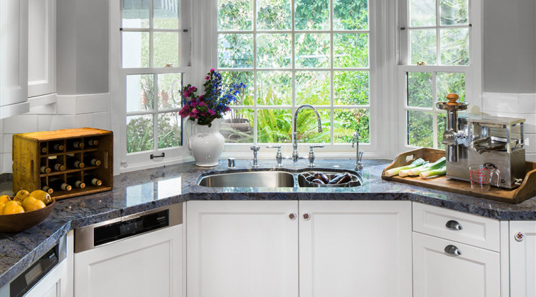 A bay window at one end of this cabinetry, countertop, cuisine classique, interior design, kitchen, room, window, gray