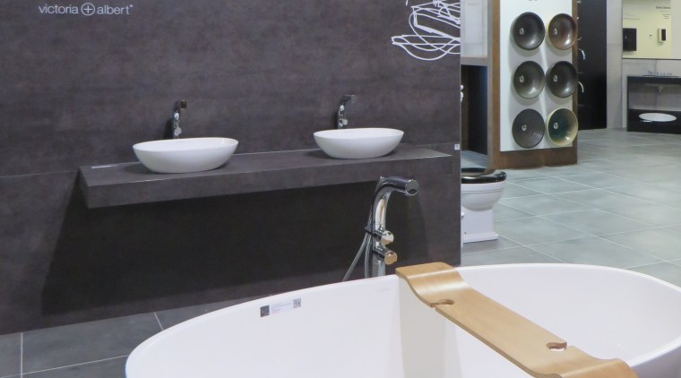 Freestanding tubs, vessel basins and bathroom accessories are architecture, bathroom, ceramic, floor, flooring, interior design, plumbing fixture, product design, sink, tap, tile, gray