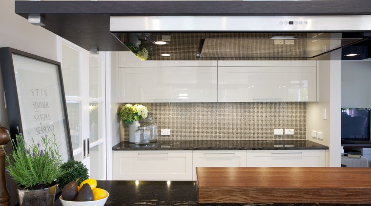 Positioning the main work area so it faces countertop, glass, interior design, kitchen, gray, black