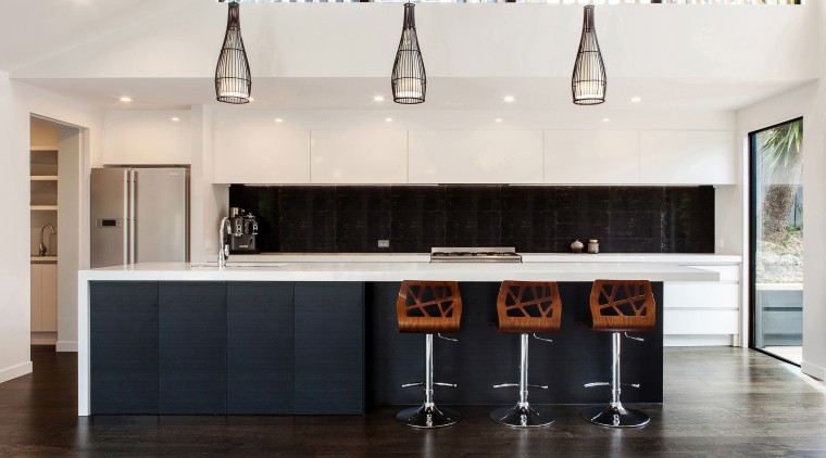 Dark wood veneer contrasts high-gloss white lacquer in cabinetry, countertop, cuisine classique, floor, flooring, furniture, interior design, kitchen, room, white, black