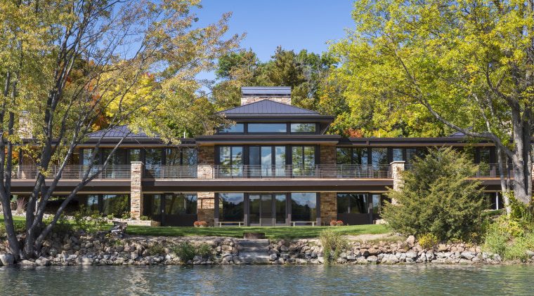 This new home, designed by Charles R Stinson bayou, canal, cottage, estate, home, house, lake, mansion, plant, property, real estate, reflection, tree, villa, water, waterway, brown