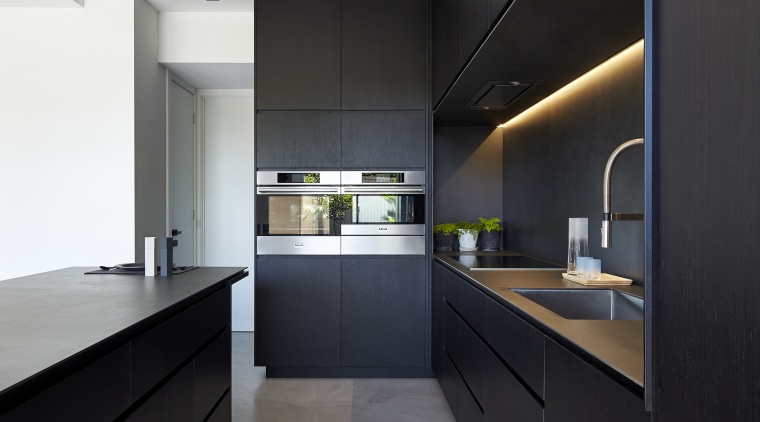 Although the cabinets in this kitchen appear black, architecture, cabinetry, ceiling, countertop, house, interior design, interior designer, kitchen, black, white