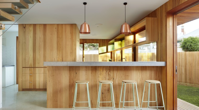 In this contemporary kitchen, an integrated refrigerator and architecture, cabinetry, home, house, interior design, lobby, real estate, wood, gray, brown