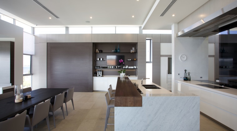 This kitchen, designed by Leon House, reinforces the ceiling, countertop, house, interior design, kitchen, living room, lobby, real estate, gray