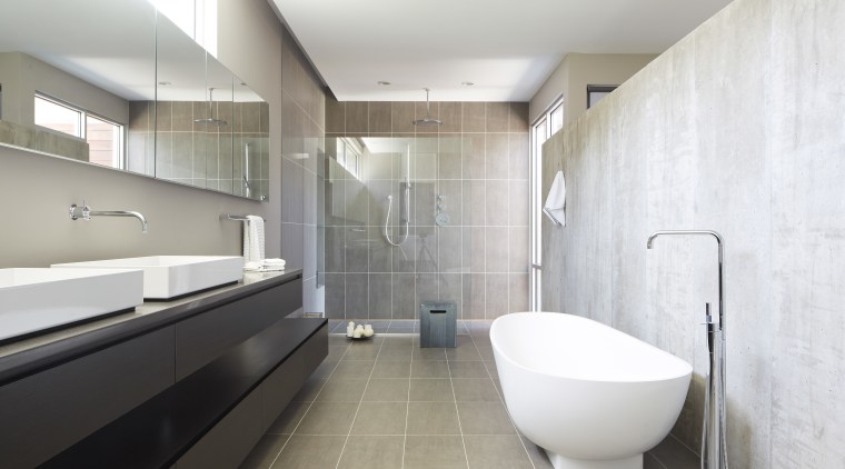 The handleless wenge vanity in this bathroom consists architecture, bathroom, floor, interior design, room, tile, gray, white