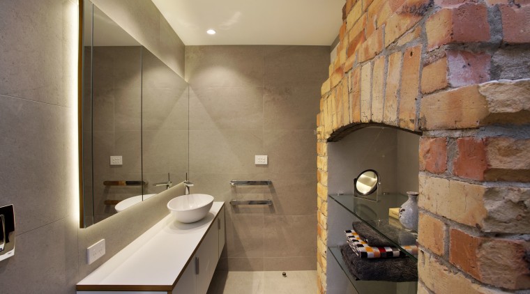 The original double-sided fireplace in this renovated villa architecture, bathroom, floor, interior design, room, tile, brown, orange