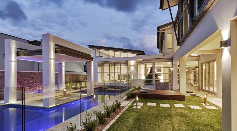 This house, by Starr Constructions, features a large apartment, architecture, condominium, estate, home, house, interior design, mixed use, property, real estate, residential area, swimming pool, villa
