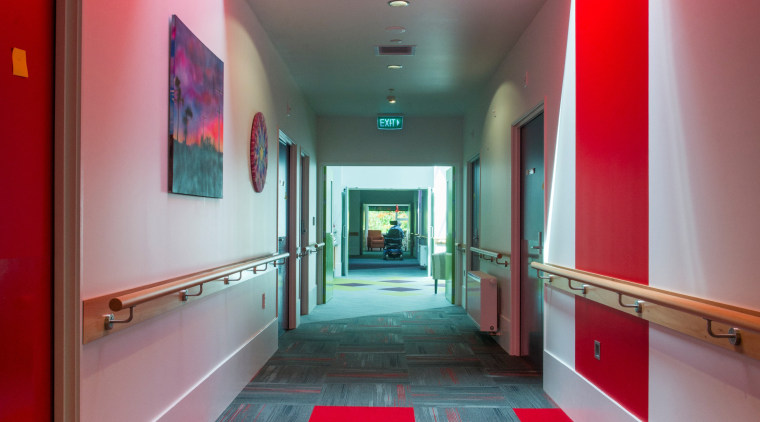 Bright Resene paints signpost different bedroom suites in architecture, ceiling, floor, flooring, hall, interior design, lobby, red