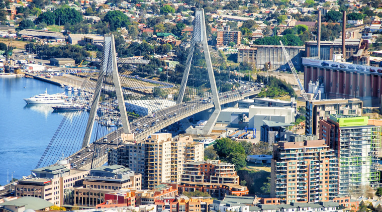 Sydneys ANZAC Bridge is one of the more aerial photography, bird's eye view, bridge, city, cityscape, daytime, downtown, fixed link, landmark, metropolis, metropolitan area, port, sky, skyline, skyscraper, suburb, tower block, urban area, urban design, water, waterway