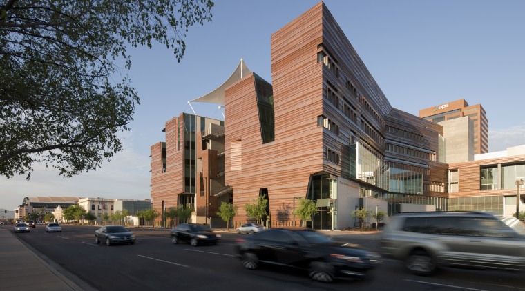While the eastern facade of the Health Sciences architecture, building, city, commercial building, condominium, corporate headquarters, downtown, facade, house, mixed use, neighbourhood, property, real estate, residential area, sky, black